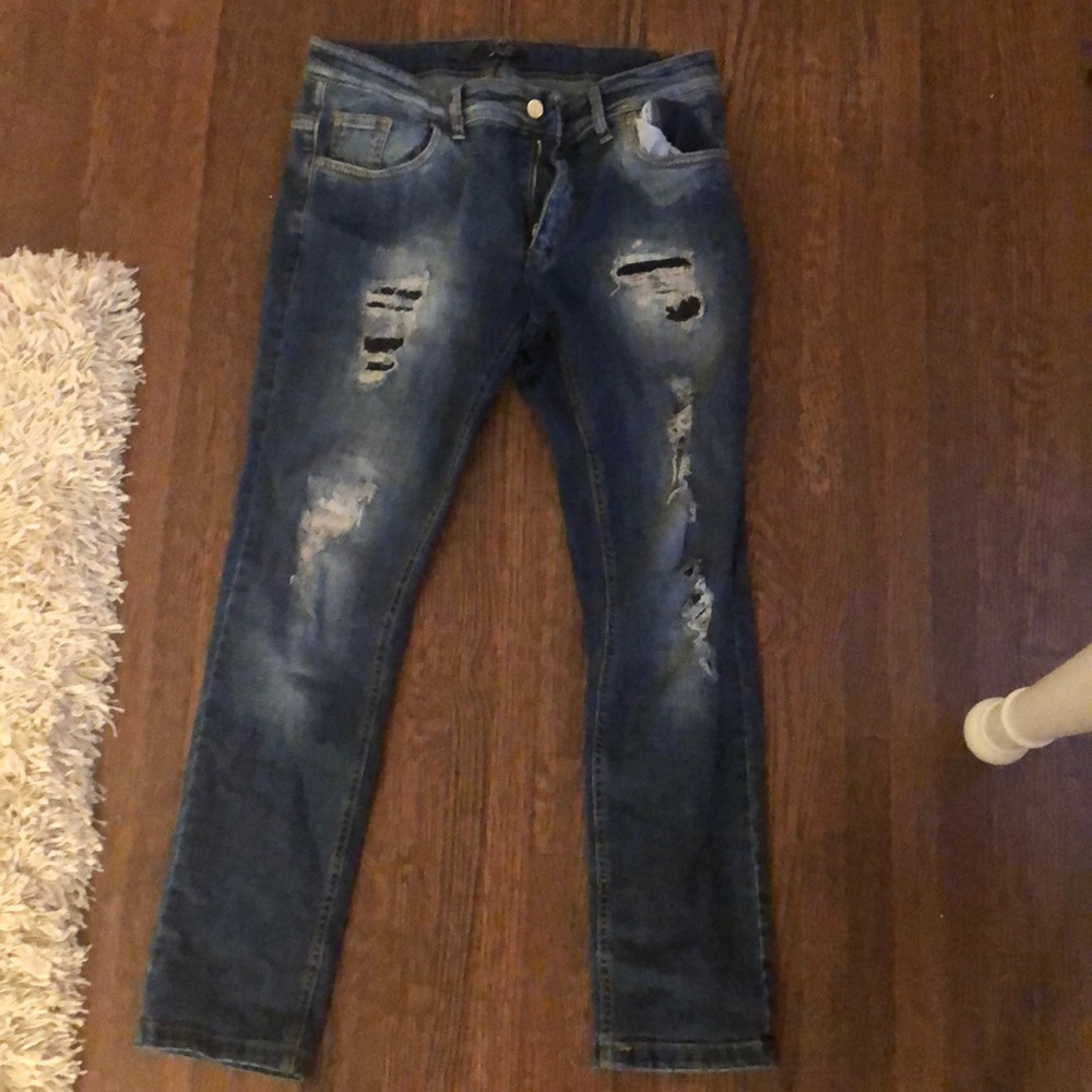 Ripped boot cut high waisted jeans